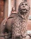 Little girl astride the San Prospero lion